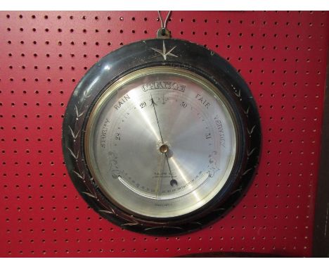 A Victorian ebonised frame Salom &amp; Co., London/Edinburgh wall mounted circular barometer 
