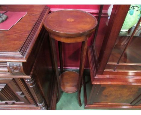 An Edwardian mahogany two tier circular jardiniere stand, 98cm high 