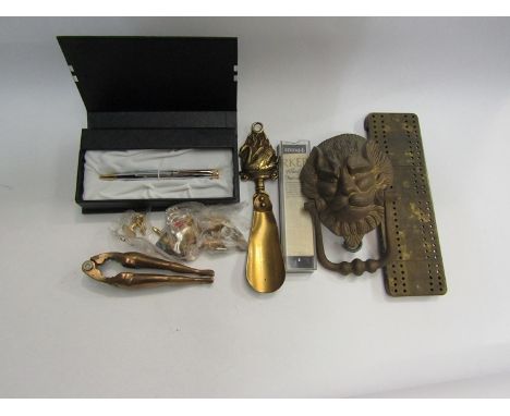 A small collection to include Parker pen, brass lion knocker, leg form nutcracker etc. 