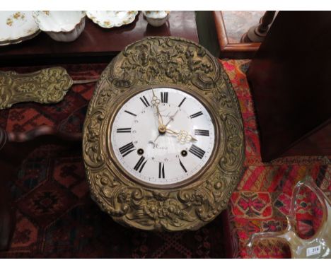 A 19th Century Comtoise clock with black Roman numerals and subsidiary Arabic numerals to the 23cm diameter white enamelled f