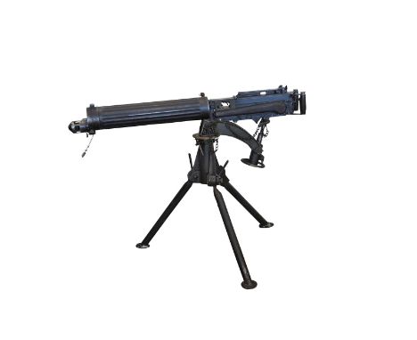 A Vickers .303 heavy machine gun, in original wooden box together with a tripod also in original wooden box, a box belt, a Te