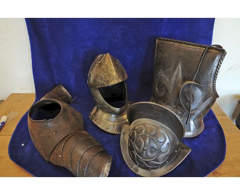 A white metal knight's helmet, a breast plate and a lobstered shoulder cover and a reproduction pot helmet. 
