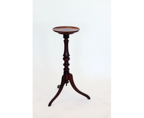 A mahogany jardiniere stand with marquetry inlaid circular tray top, turned stem and tripod legs. 10½ins diameter. 