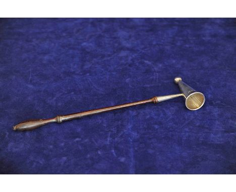 An Elizabeth II silver candle snuffer with orb finial and tapering body, on a turned fruitwood handle. London 1972. Maker C J