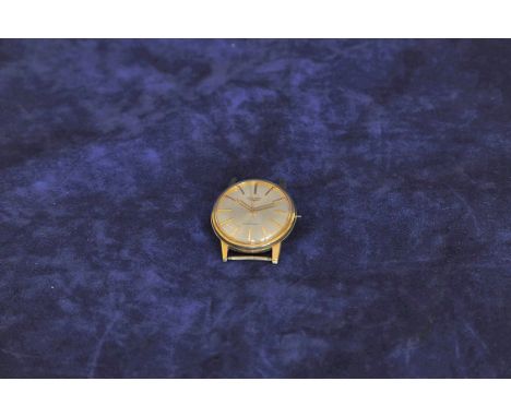 A Longines 9ct gold cased automatic wristwatch with gilt baton numerals and engine turned dial (af). 