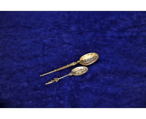 An Edward VII Celtic inspired spoon with twisted and scroll decorated stem and scroll decorated bowl. London 1902. Makers Elk
