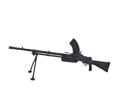 A Vickers Berthier .303 light machine gun with attached tripod and magazine, the gun numbered 240. 