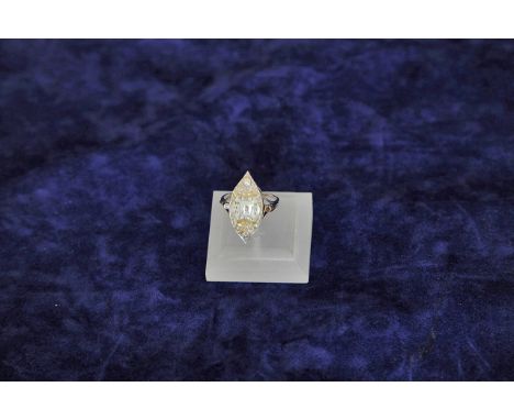A ladies white metal and diamond set watch ring with seventeen ruby movement, the dial with Arabic Numerals and with leaf sha