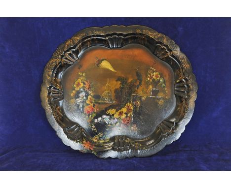 An oval papier mache tray, the central field with depiction of peacocks and floral sprays inlaid with mother of pearl. 26 by 
