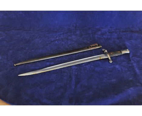 A Portuguese model 1886 sword bayonet with 18½ins blade, inscribed to top 1886, with wooden handle, white metal hilt and stee