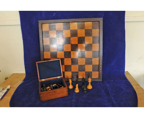 A Jacques London chess set comprising thirty two pieces together with a chess board with bone inlay. 24ins. 