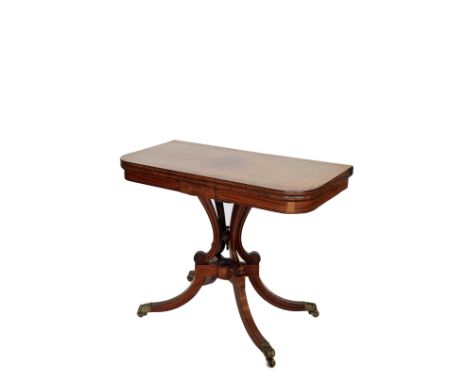 A Victorian mahogany satinwood and boxwood strung 'D' shaped card table, the fold-over top opening to reveal a green baize li