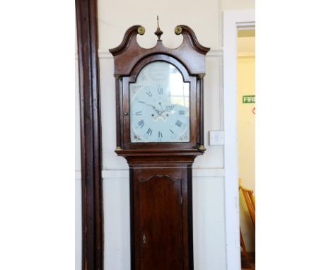 An 18th century longcase clock, the hood with broken arch pediment and reeded pilasters, the arched dial with Roman numerals 