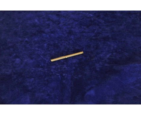 A 9ct gold propelling pen / pencil / penknife of cylindrical form with engine turned decoration. 3¾ins. 