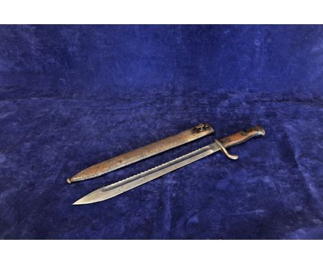 A German pioneers bayonet with saw back 14½ins blade, stamped H. Mundlos & Co Magdeburg together with its white metal scabbar