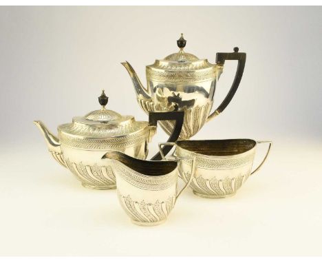 A Victorian four piece silver tea and coffee service, William Hutton &amp; Sons, London 1886, each piece of oval form with em