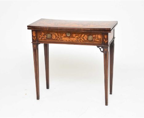 A late 18th century Dutch marquetry card tableThe fold-over top inlaid with a flower filled urn and scrolling foliage support