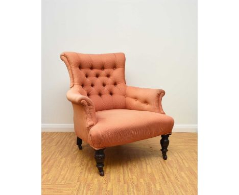 Two 19th century upholstered wing armchairsThe first of button back form, raised on turned mahogany front supports and castor