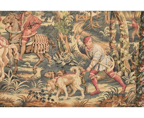 A French tapestry wall hanging, first half 20th centuryWoven with a medieval hunting scene in a bucolic landscape, within a b