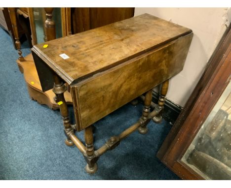 A small antique walnut gate leg table in the William and Mary style 