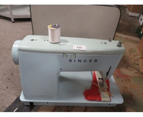 A Vintage cased Singer sewing machine model 347 