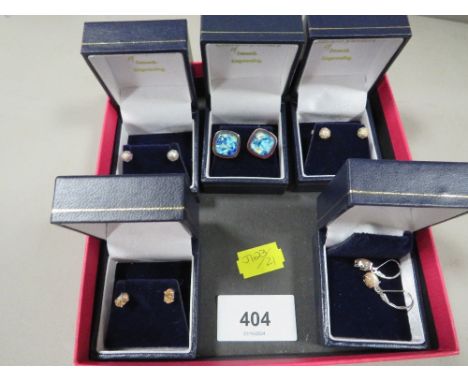 Five boxed pairs of silver earrings etc, together with a loose pair of earrings and a ring