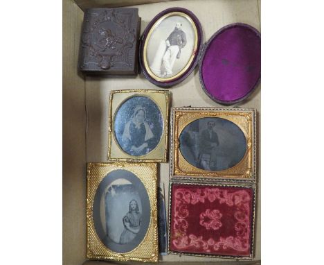 A selection of vintage daguerreotypes, frames etc, to include an unusual ambrotype holder in the form of a book