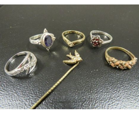 A collection of 5 assorted silver and other dress rings together with a stick pin (6) 