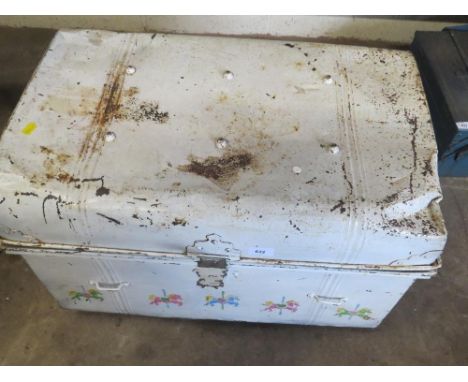 A steel travel trunk and contents to include a tilley lamp and a fire grate front 