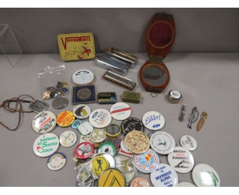 A vintage mahogany travelling mirror, enamel badges etc