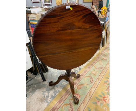A reproduction mahogany Chippendale style pedestal table with a birdcage mechanism 
