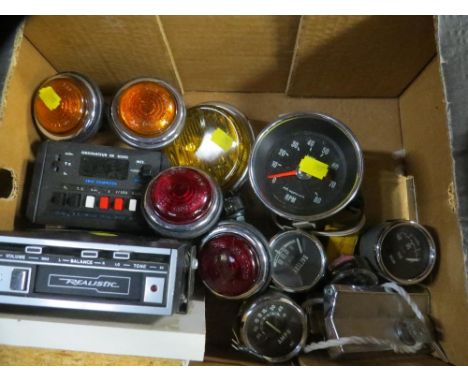 A tray of vintage car parts lights/gauges and a cassette player 