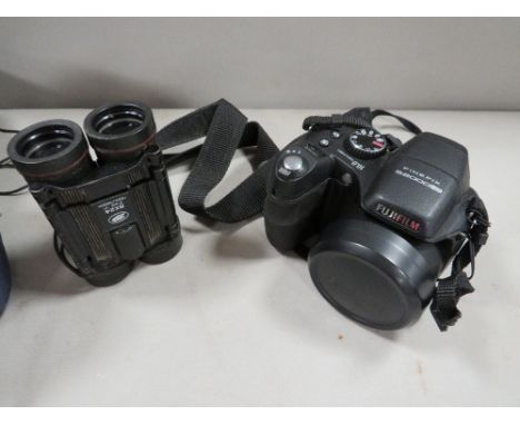 A Finepix S2000HD camera/binoculars and bag 