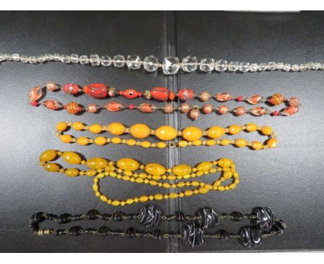 Five strings of vintage glass beads 