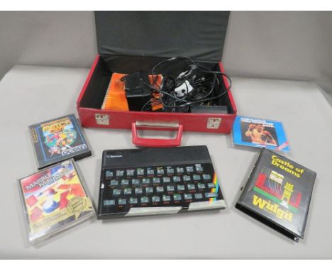 A vintage Sinclair ZX Spectrum 48K together with a many games (unchecked) 