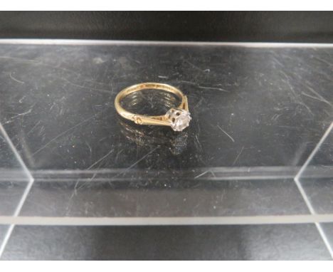 A hallmarked 18 carat gold diamond solitaire ring estimated carat weight 15pts approx. weight 2.5g 