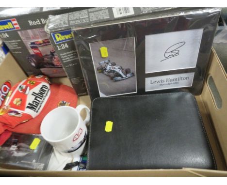 A tray of Formula One collectables to include a vintage Marlboro grand Prix of Argentina hat with enamel pin badges, model ki