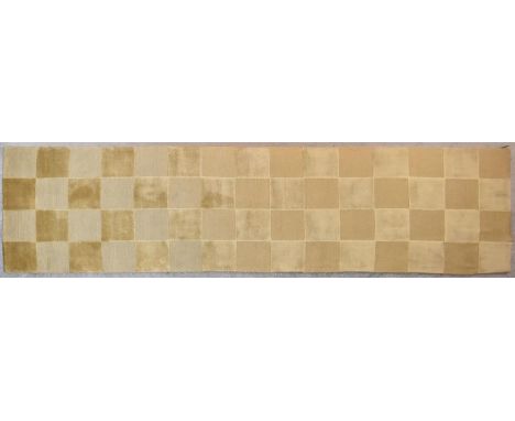 A silk and wool runner with gold and beige chequerboard design. L.360x97cm