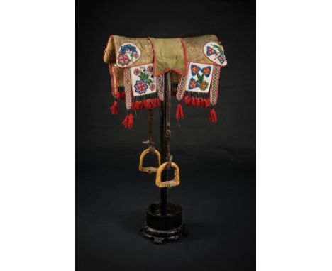 dating: Early 19th Century provenance: North America, Leather, lined, cushion-shaped saddle, the border profiled in red. A sm