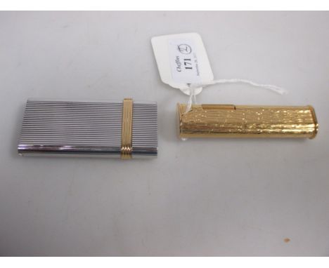 A gold palted Dunhill lighter and a chrome and gilt lighter by Christian Dior (2)  