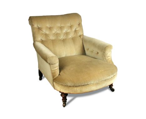 A Howard style walnut framed armchair stamped K + S, button upholstered back, on turned legs and brass casters 78 x 79cm (30 