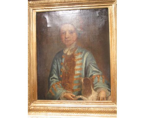 French School, 18th century, portrait of a young boy in a blue frocked coat with a King Charles Spaniel, oil on canvas, 64 x 