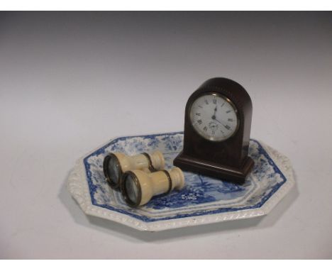 A Minton blue and white tureen stand, a mantel clock and a pair of binoculars with ivory barrels  