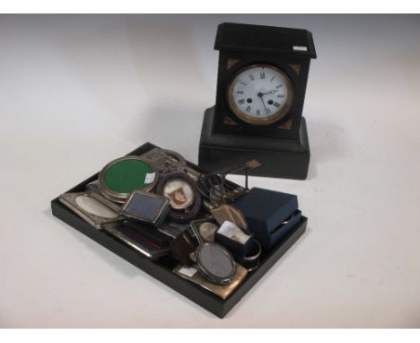 A quantity of silver and silver plated items and a black slate mantel clock  