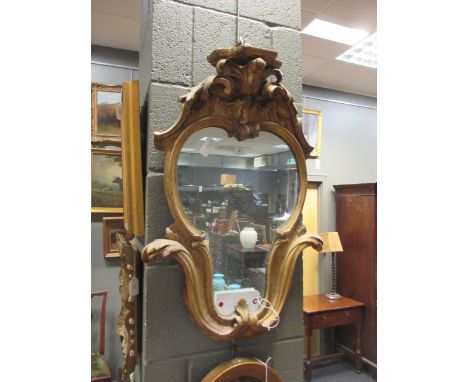 A 19th century gilt wood pier mirror with shelf crested top, 72cm high  