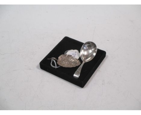 A Victorian silver caddy spoon, London 1883 and a Victorian vine leaf shaped caddy spoon (2)  