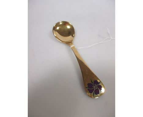 A Georg Jensen silver gilt and enamel decorated spoon for 1974, 15cm long  