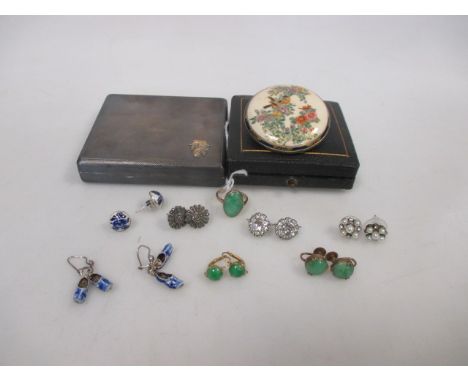 An 18ct oval jade cabochon ring and a pair of jade earrings in unmarked yellow precious metal, together with a a pair of jade
