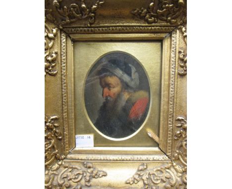 A late 18th century portrait of an elderly gentleman, bearded and wearing fur, oil on board (?), gilt frame  