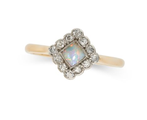 AN OPAL AND DIAMOND RING in 18ct yellow gold, set with a cabochon opal in a border of single cut diamonds, stamped 18ct, size